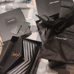 Black with gold setting YSL(Saint Laurent) shoes. Shoe size 38 1/2